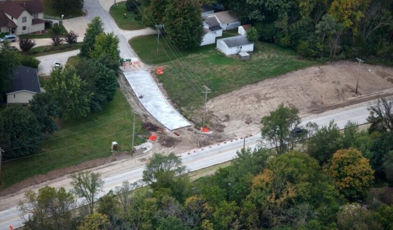 Aerial view of a residential to roadway construction zone.