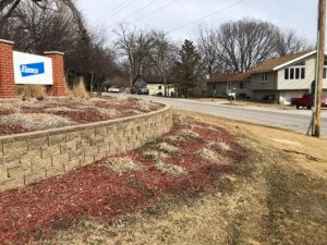 stone retaining wall with mulch