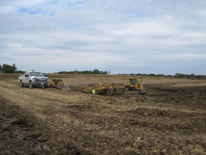 A photo showing earthwork taking place for the construction of a controlled discharge lagoon.