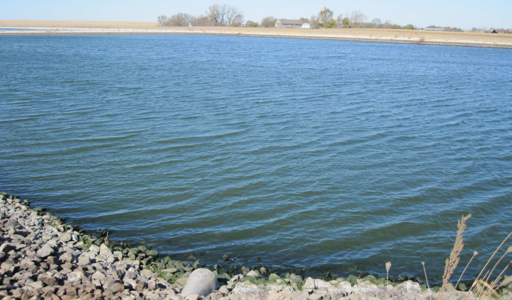 large wastewater lagoon with water ripples