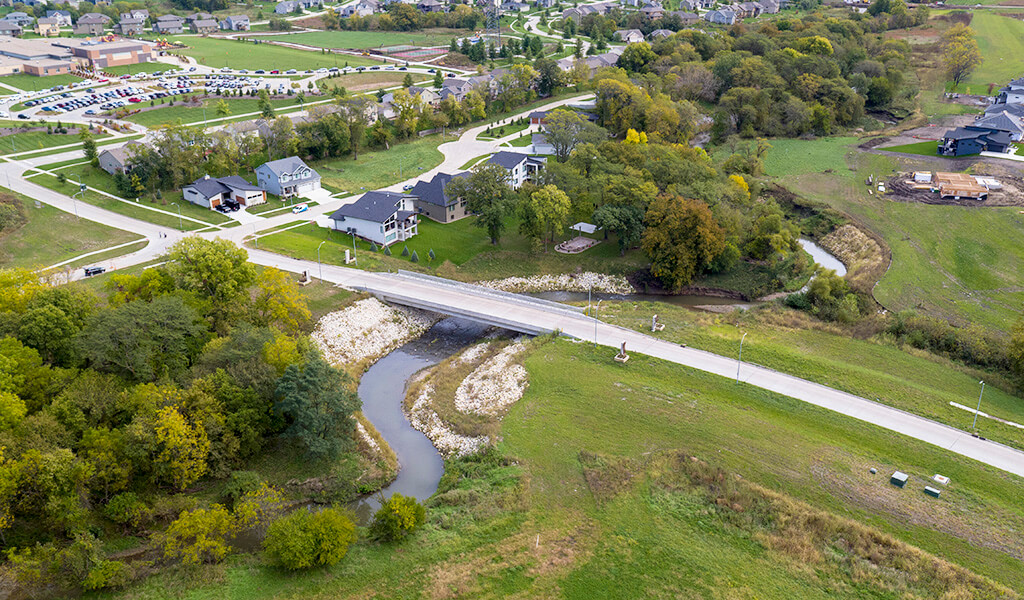 An aerial view of a new bridge over a realigned segment of Sugar Creek in West Des Moines.
