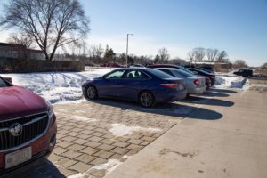 Cars parked on permeable paver lot in front of Fire Station 14 in Madison.