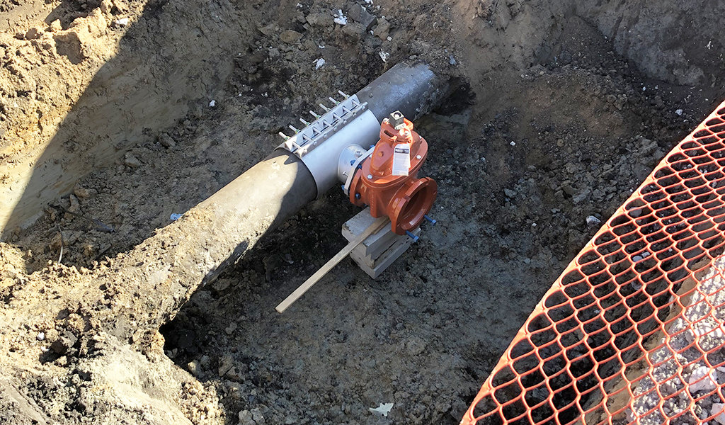 large gate valve exposed underground