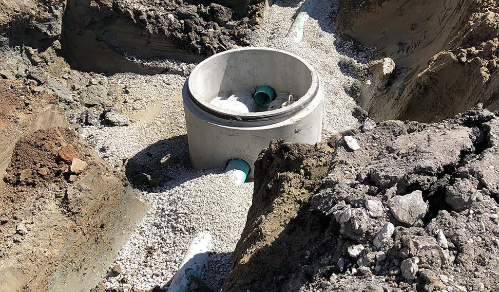 sewer intake pipe sticking out of the ground