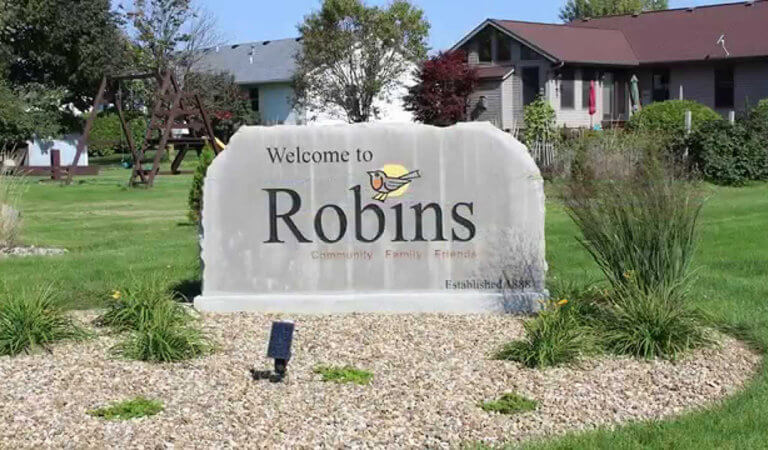 Large stone welcome sign to the city of Robins