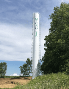 white standpipe water storage tank for Magnolia. Community Water Storage