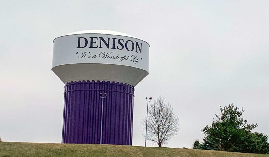 Large puple and white Denison water tower