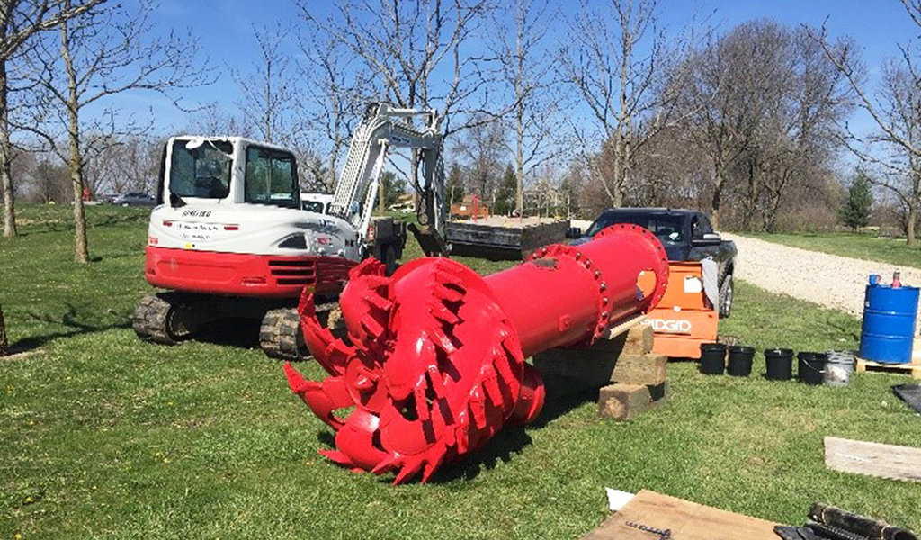 large red hydraulic dredge