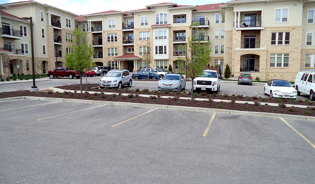 97 On-grade parking spaces in the Pleasant View apartments courtyard in Madison, WI.