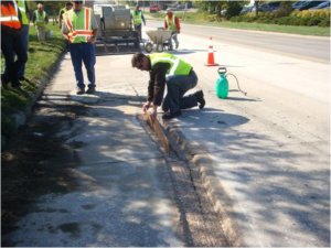 Construction crew installing new pavement