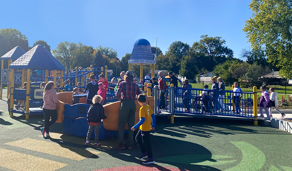 The community enjoying playing at the inclusive Kiwanis playground
