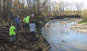 Snyder & Associates environmental scientists inspect river toe rock