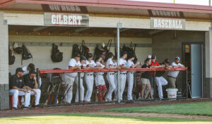 baseball players in dugout at gilbert high school