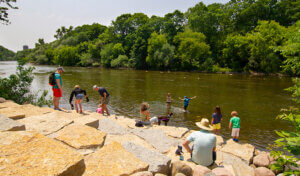families playing in the river at Hubbard park launch