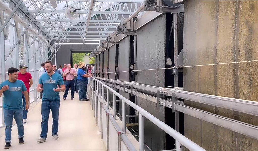 visitors walk inside the new Slater greenhouse and view RAB belts
