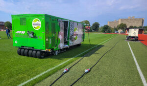 Grass stitching machine on soccer field