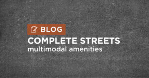 dark grey road background with title complete streets multimodal amenities