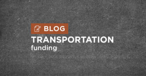 dark grey road background with title Transportation funding blog
