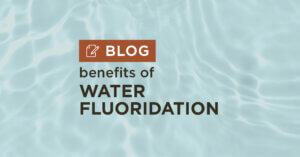 blue water background with title benefits of water fluoridation blog