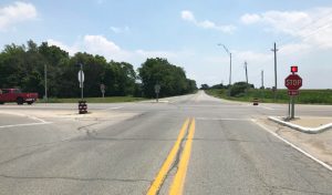 view down the middle of a road with double yellow stripe