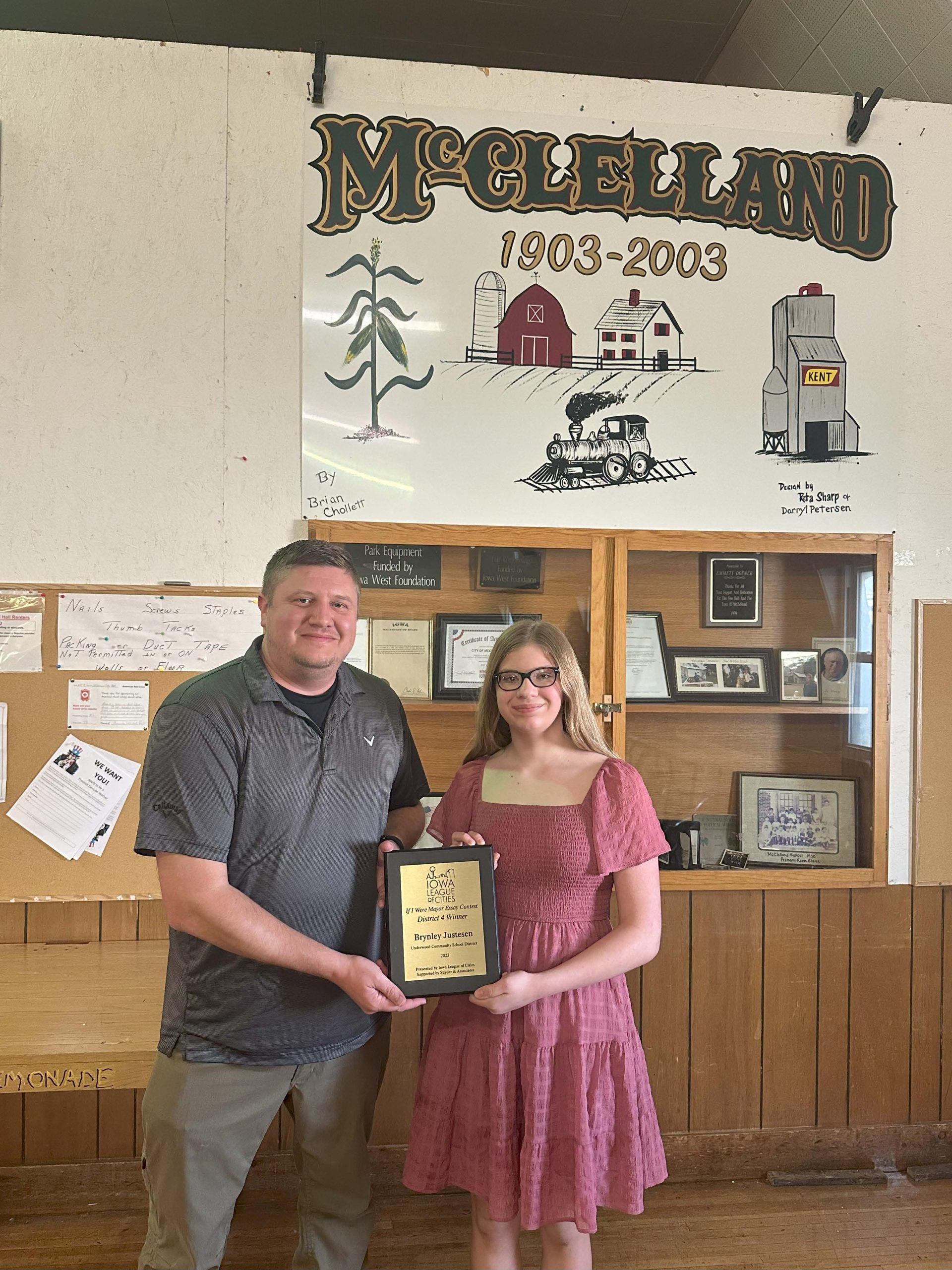 2025’s “If I Were Mayor” District 4 winner, Brynley Justeson holding up award