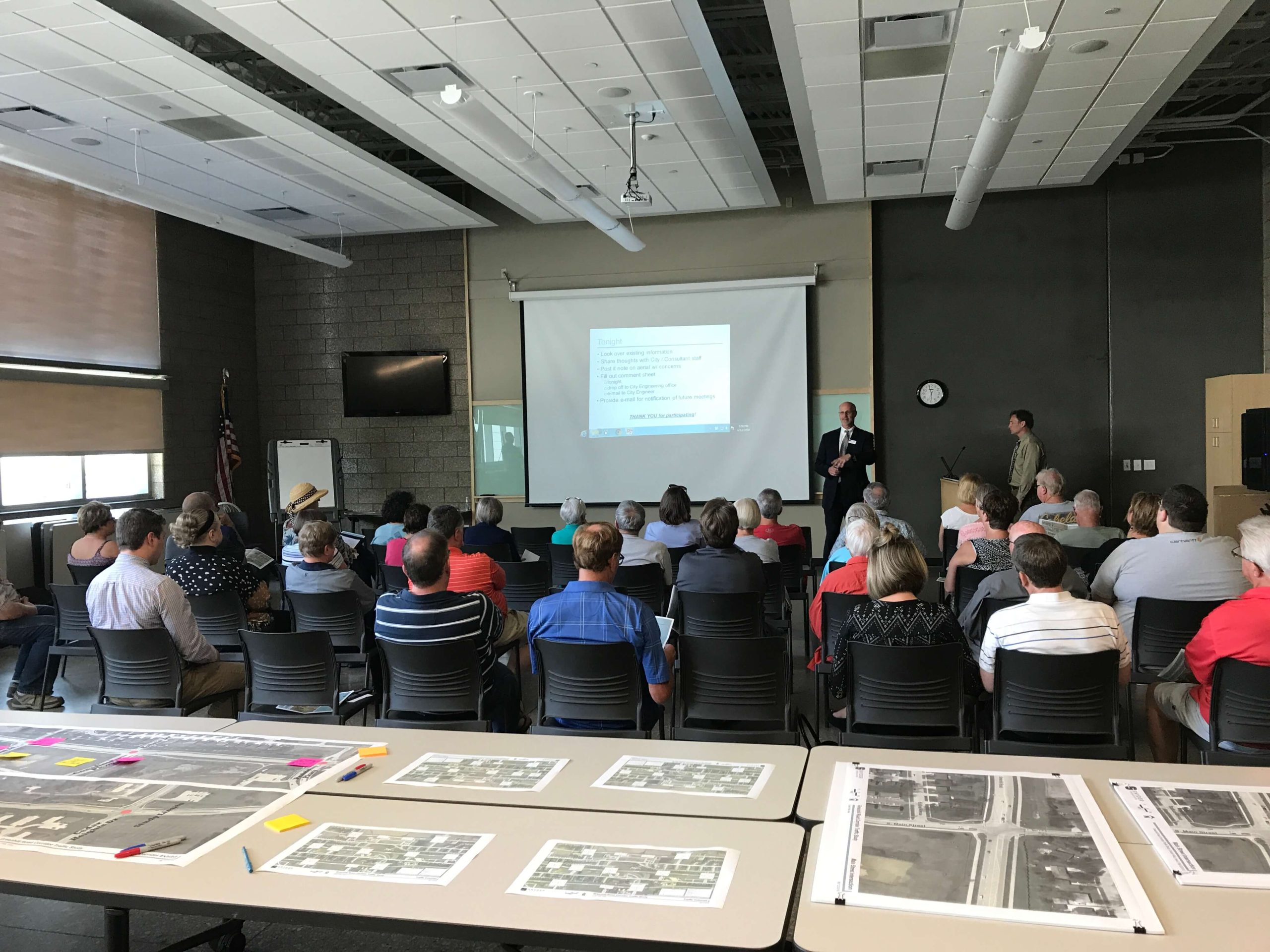 People gather for public engagement presentation