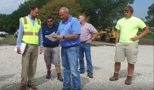 Engineer and contractor discussing project site 