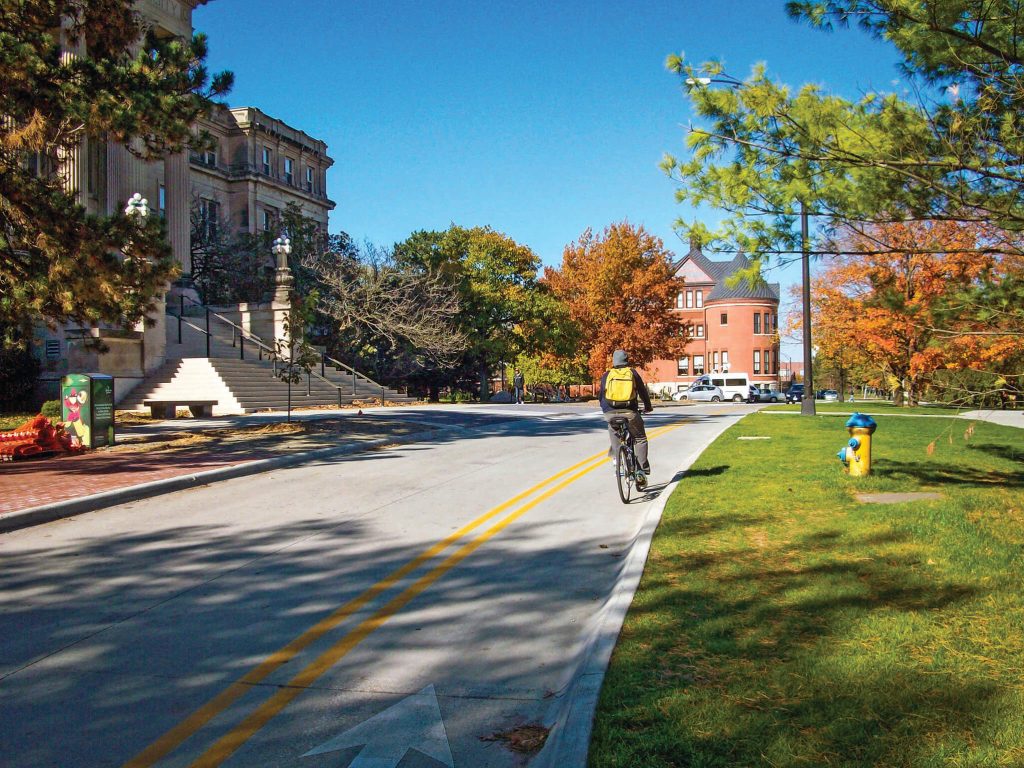 cyclist traveling in a contra-flow bike lane at ISU Morrill Lane