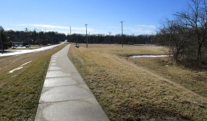Sidewalk trail along side busy road