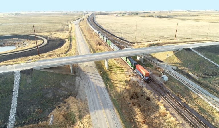 |||lush green stormwater culvert|black and white map with project area outlined in red|traffic backed up bumper to bumper|||||
