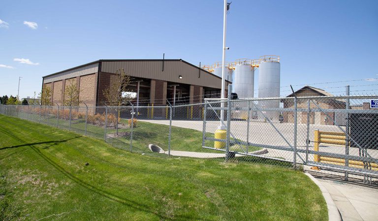 gated area before entering work site|large fuel tanks in a row|Blending facility