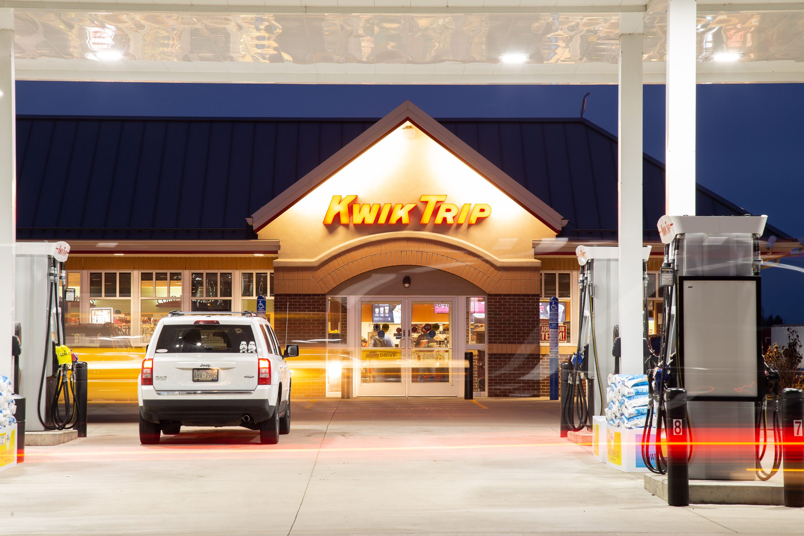vehicle parked next to fuel pump in front of a recently complete kwik trip in deforest wisconsin