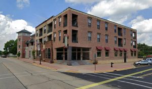 brick multi-use building on a corner