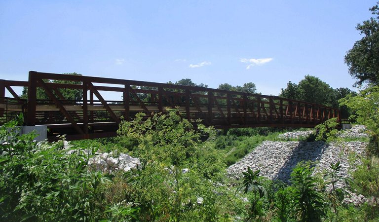 Bridge on the Railroad highway trail|Pre-construction of the railroad highway trail|Bridge on the Railroad highway trail|Trail pavement of the Railroad Highway Trail|Map of the Railroad Highway trail