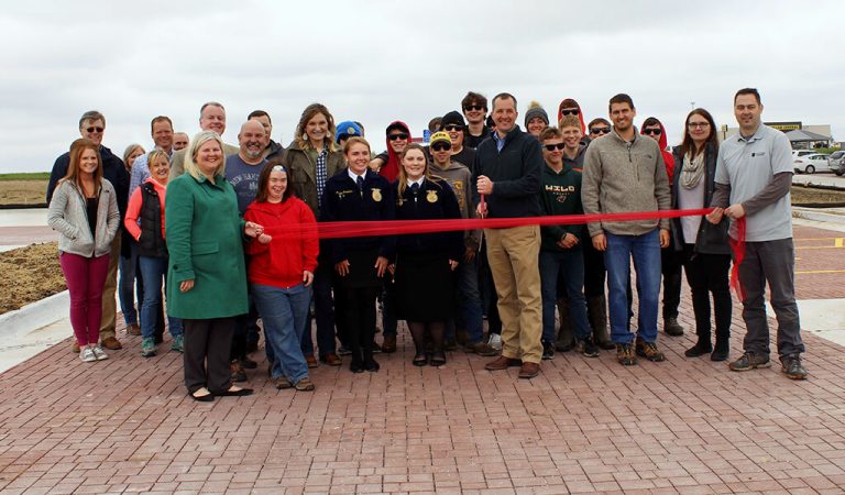 Group of people prepare to cut red ribbon|Illustration of A watershed inventory and analysis
