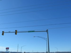 A street view of the traffic signal system with blue sky