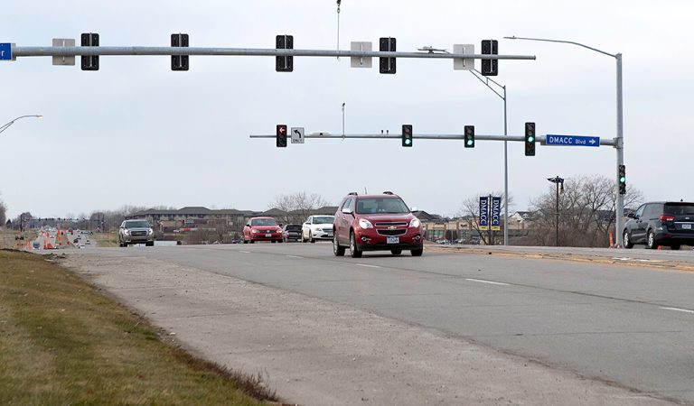 cars driving through an intersection||cars driving through an intersection|cars driving through an intersection|cars driving through an intersection