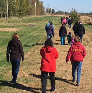 Group of people walking a trail