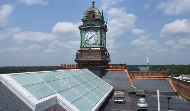 newly constructed clock tower|Historic clock tower|Historic clock parts preserved|Newly constructed skylight|Old skylight being assessed|Clock tower construction|Central skylight|Webster County Courthouse
