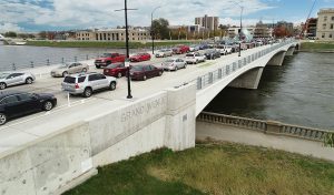 bridge over river with cars driving across