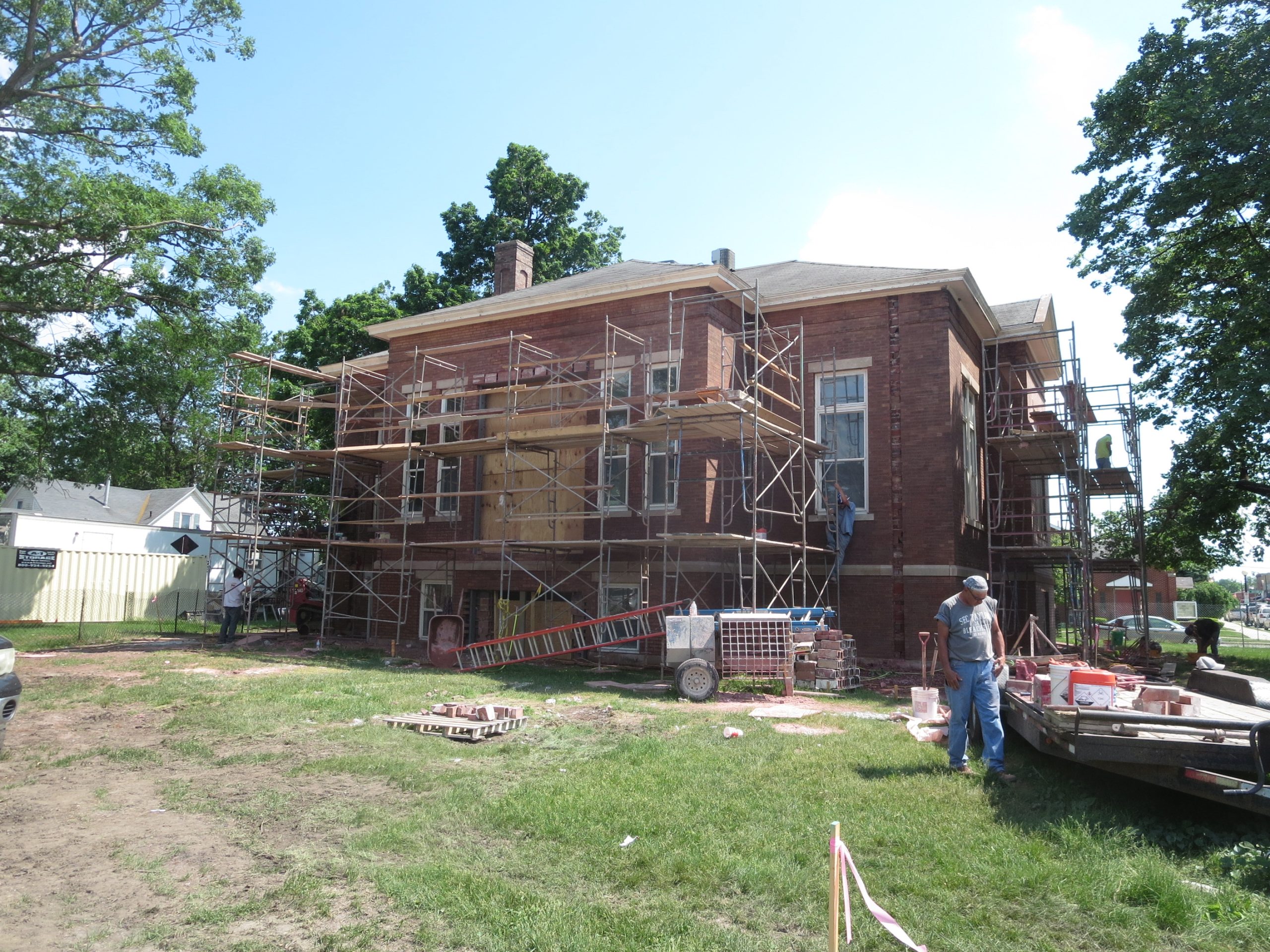 construction crew updating the exterior of des moines opera house