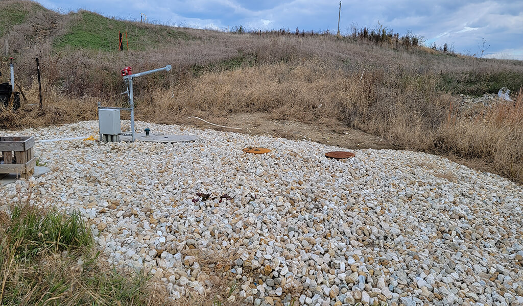 Leachate Disposal Lift Station at Des Moines County Landfill|excavator digging trench for sewer force main|Leachate Disposal Submersible Wet Well Lift Station|Leachate Disposal Construction of Force Main|Leachate Disposal Wastewater force main Cleanout