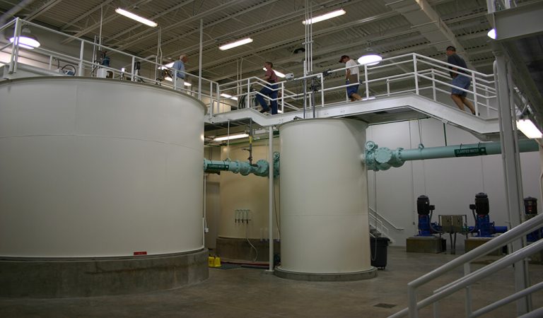 inside view of new water treatment plant||||two lime storage lagoons|large circular softener unit|||entrance to camp dodge