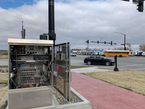 Adaptive Signal Technology control box with intersection in the background