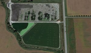 aerial view of large lagoon cell drained for construction