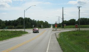 Red truck turning at 4-way intersection
